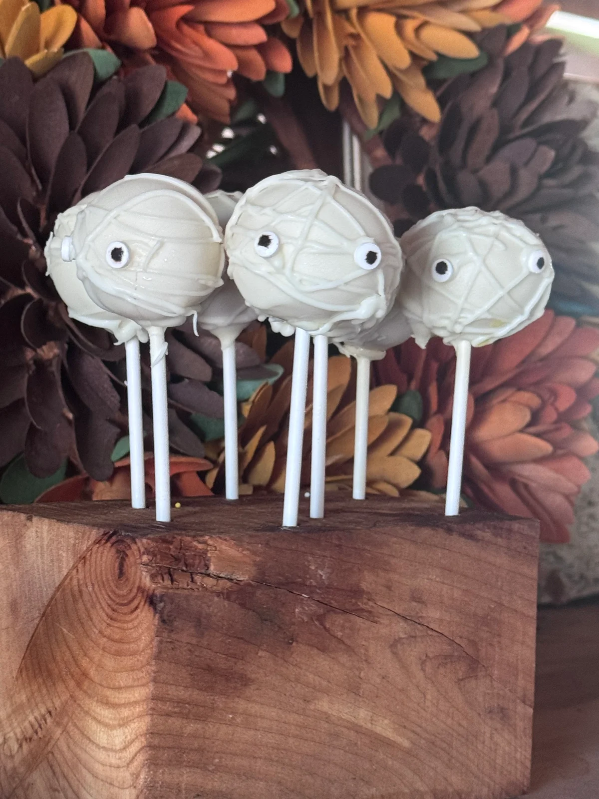 White mummy cake pops with candy eyes